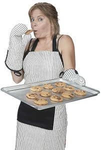 Woman cook eating cookies